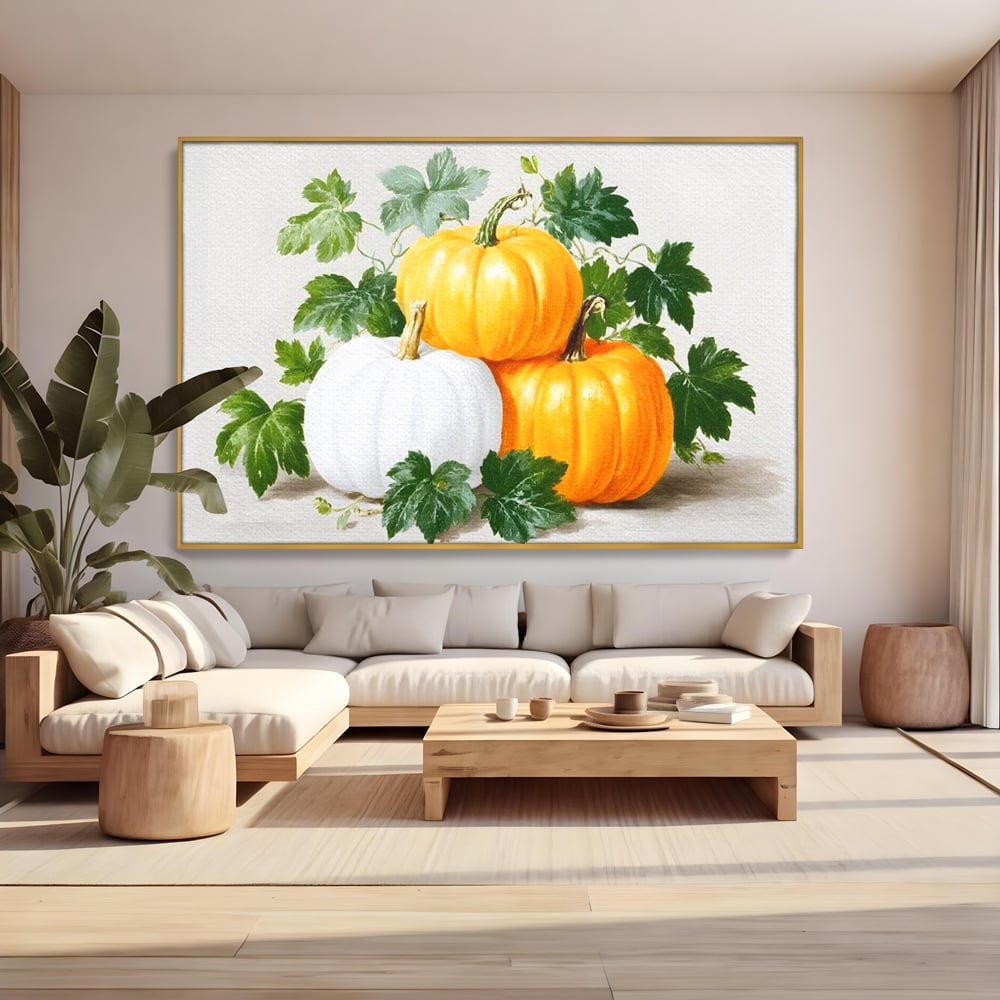Tablou canvas cu pictura decorativa cu trei dovleci, in rama de aluminiu auriu, pe perete intr-un living